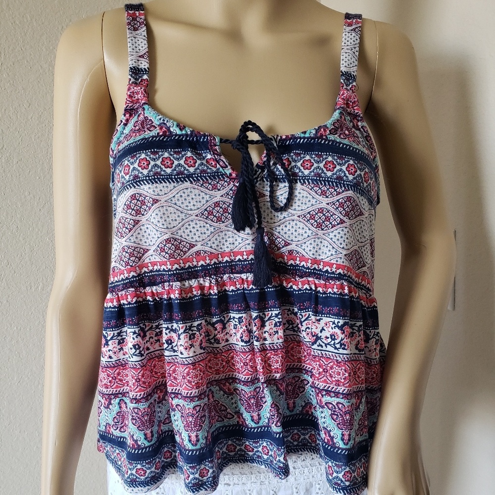 New with tags.Patterned tank with lace back